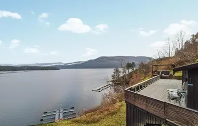 a house with a view of a lake at Amazing Home In Omastrand With Wifi in Gjuvsland