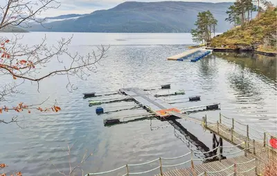 a dock in the middle of a body of water at Amazing Home In Omastrand With Wifi in Gjuvsland