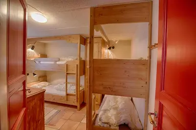 a room with three bunk beds in it at Large Cabin with Stunning Views! in Beitostøl