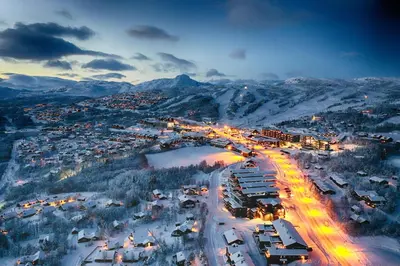 an aerial view of a city in the snow at night at Large Cabin with Stunning Views! in Beitostøl