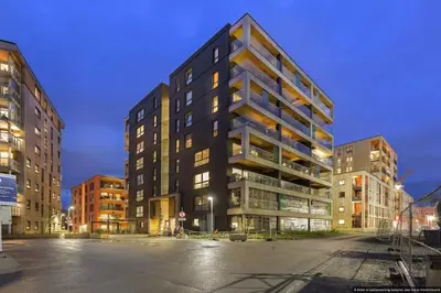 a tall building in the middle of a street at Eksklusiv byleilighet med utsikt i Trondheim Sentrum in Trondheim