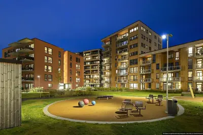 a playground in a park in front of some buildings at Eksklusiv byleilighet med utsikt i Trondheim Sentrum in Trondheim