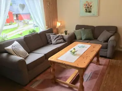 a living room with a couch and a coffee table at Oceanview House Ideal for Peaceful Holidays in Venøya