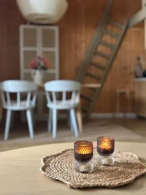 two candles sitting on top of a table at Pen hytte nær Ål in Liagardane