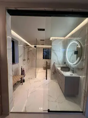 a large white bathroom with a shower and a sink at Eksklusiv Enebolig in Bergen