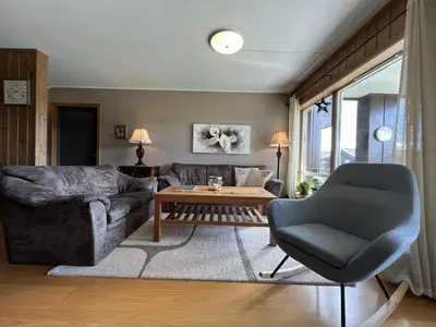 a living room with a couch and a chair at Cozy Getaway Sauna and Terrace in Beitostøl