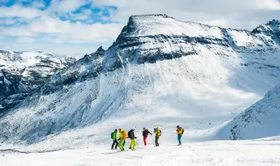 a group of people standing on a snow covered mountain at Phillipshaugen Lodge in Øksendalsøra