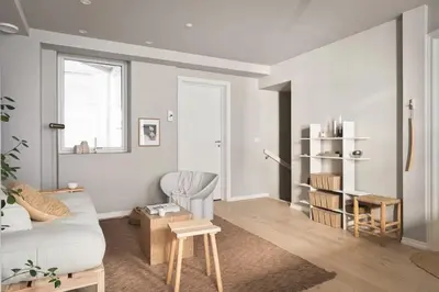 a living room with a couch and a table at Stay l Nordnes in Bergen