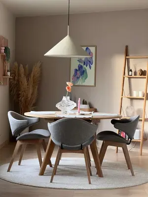 a dining room table with chairs and a light fixture at Apartment in Bergen in Bergen
