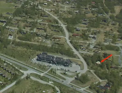 a red mark on a road in a parking lot at Modern Comforts, and Ski Access in Beitostøl
