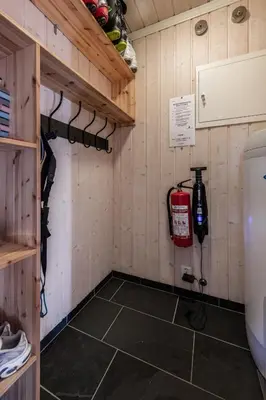 a garage with a fire hydrant in a room at Kikut Panorama Geilo Ski-in Ski-out in Geilo