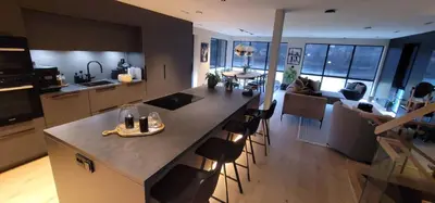 a kitchen with a island in the middle of a room at Unique 3-Storey House in Trysil Luxury Living in the Heart of the Village in Trysil