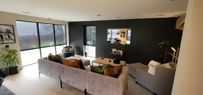 a living room with two couches and a table at Unique 3-Storey House in Trysil Luxury Living in the Heart of the Village in Trysil