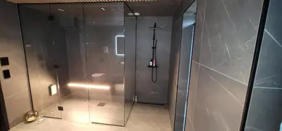a shower with a glass door in a bathroom at Unique 3-Storey House in Trysil Luxury Living in the Heart of the Village in Trysil