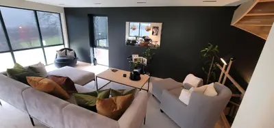 a living room with two white couches and a table at Unique 3-Storey House in Trysil Luxury Living in the Heart of the Village in Trysil