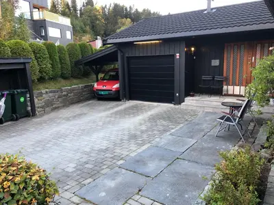 a garage with a car parked inside of it at Sjarmerende enebolig in Trondheim