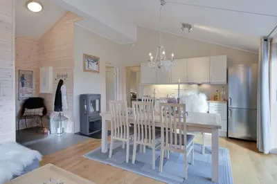 a kitchen and dining room with a table and chairs at Modern Apartment with 3 Bedrooms and Stunning View in Beitostøl