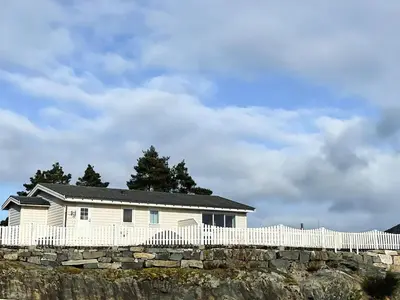 a house on top of a stone wall at 6 person holiday home in HOSTELAND in Hosteland
