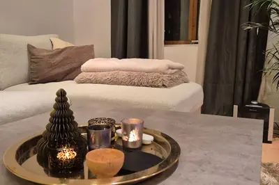 a living room with a coffee table and a couch at Luxurious city apartment in Bergen
