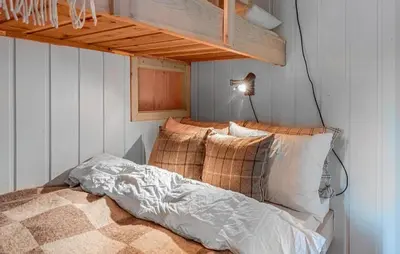 a bedroom with a bed with pillows on it at 4 Bedroom Stunning Home In Hemsedal in Hemsedal