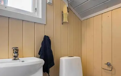a bathroom with a sink and a white toilet at 4 Bedroom Stunning Home In Hemsedal in Hemsedal