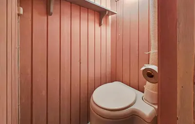 a bathroom with a toilet and a roll of toilet paper at 2 Bedroom Awesome Home In Vikersund in Vikersund