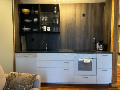 a kitchen with a sink and a counter top at Retro Apartment in Bergen
