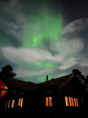 an image of the northern lights in the sky over a house at Countryside Cabin With Jacuzzi Near Stryn in Sølberg