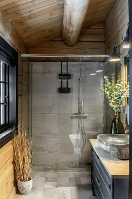 a bathroom with a shower and a sink at Modern Log Cabin With Hot Tub And Sauna in Veggli