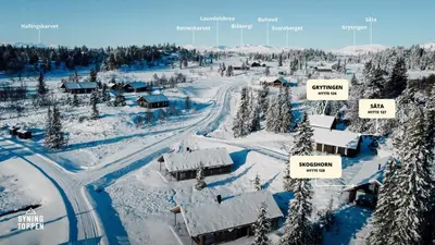 an aerial view of a village covered in snow at Charming Summer Farm Hut At Sjusjøen in Torpo