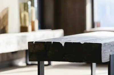 a table with a wooden bench in a room at Modern And Inviting Cabin In Valdres in Aurdal