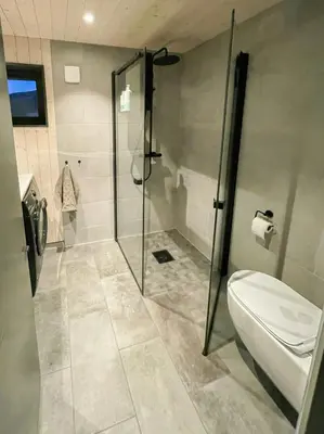 a bathroom with a shower and a toilet at Stylish Mountain Cabin In Hallingdalen in Flå