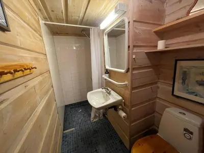 a small bathroom with a sink and a toilet at A Cozy, Rustic Retreat With Fireplace And Terrace in Beitostøl