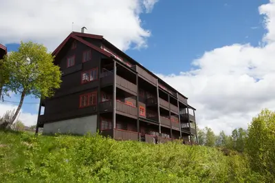 a large building on top of a hill at Modern 2-Bedroom Apartment In Ideal Location in Beitostøl