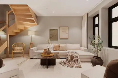 a living room with a white couch and stairs at Luxurious Villa in the heart of Bergen with private parking in Bergen