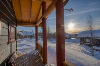 a porch of a house with snow on the ground at Nostalgic Cabin With 3 Br, Fireplace, And Terrace in Beitostøl