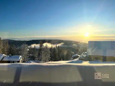 a truck parked on top of a snow covered mountain at New modern cabin at Norefjell with sauna in Noresund
