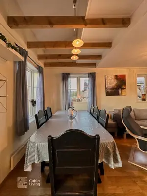 a dining room with a table and chairs at Modern apartment Hovden ski in-out x-skiing, 2 bathrooms and balcony in Hovden