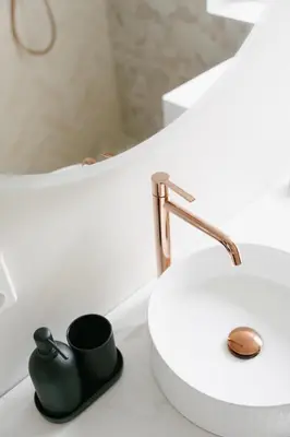 a bathroom with a sink and a black mug on a counter at New Apartment in Historical street in Bergen