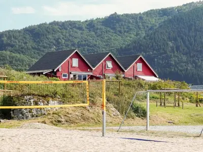 a group of houses on a hill with a goal at 4 person holiday home in Sørbøvåg in Sørbø