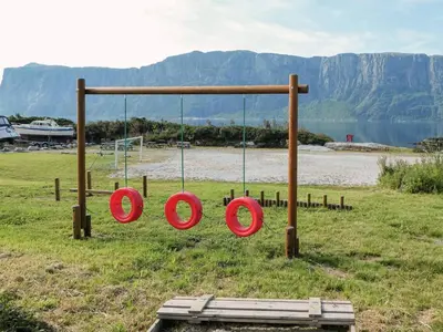 a group of red frisbees on a swing at 4 person holiday home in Sørbøvåg in Sørbø