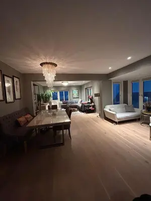 a large living room with a couch and a bed at Singsaker Panorama in Trondheim