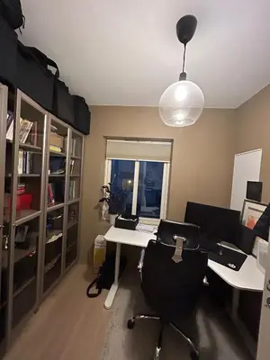 an office with a desk and a chair in a room at Singsaker Panorama in Trondheim