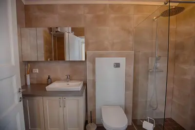 a bathroom with a toilet and a sink and a shower at Perfect Base For Skiing And Local Events in Beitostøl