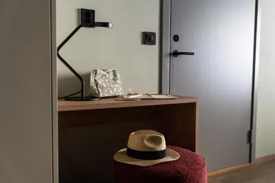 a hat sitting on a table next to a door at VANDER Altona in Bergen