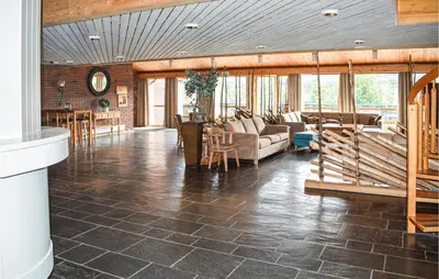 a living room with a couch and a table at Geilo sentrumsnær leilighet in Geilo