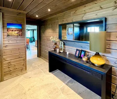 a home office with a desk and a mirror at Family Cabin With Ski-Inski-Out In Trysil in Trysil
