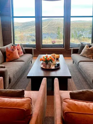 a living room with couches and a table with oranges on it at Family Cabin With Ski-Inski-Out In Trysil in Trysil