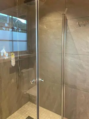 a shower with a glass door in a bathroom at Cosy Holiday Home With Stunning Views In Rauland in Rauland