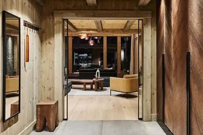 an open hallway with a living room with couches at Luxury Cabin With Views in Stranda